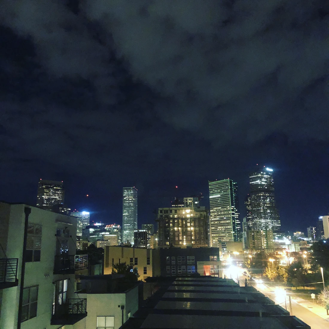 Downtown Denver buildings and city lights at night