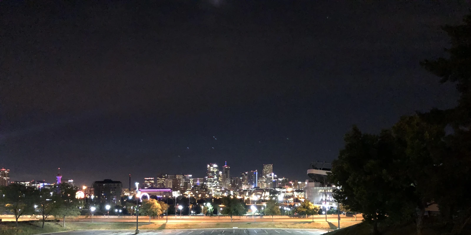 Denver skyline illuminated at night, photographed by Uriel K Carter